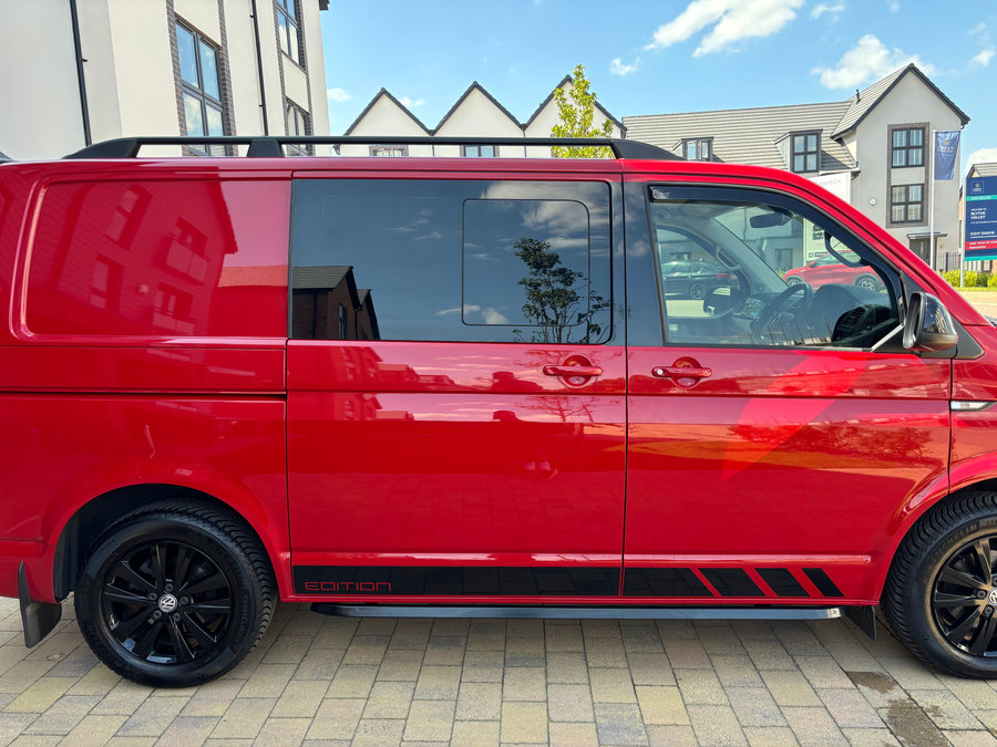 Red Volkswagen van with tinted side glazing from LuxTint’s portfolio